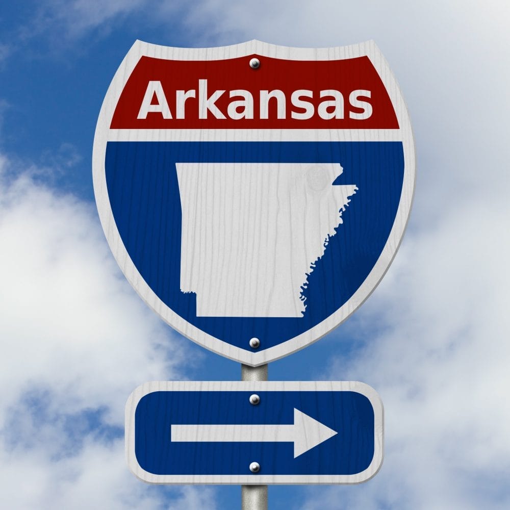 Street sign to Arkansas
