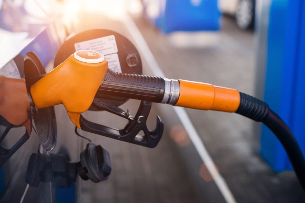 A gas pump inserted into a car
