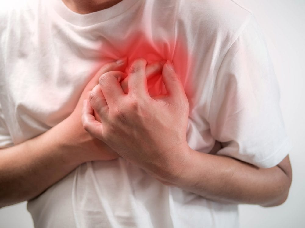 Heart attack concept. Man suffering from chest pain on white background, Health care