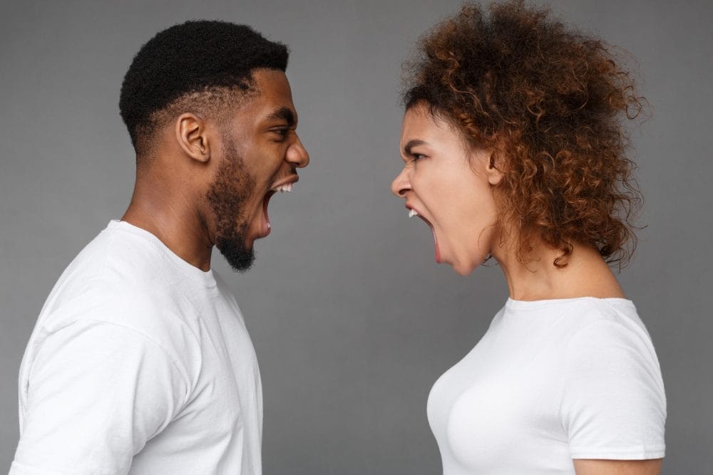 A man and a woman yelling at each other in an argument
