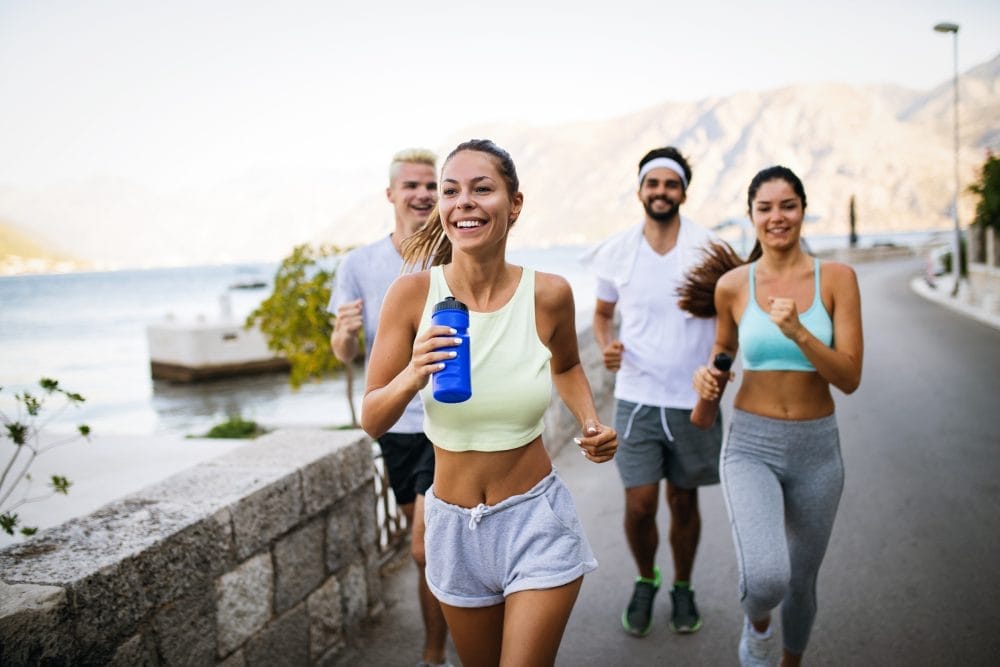 Millennials running outside together