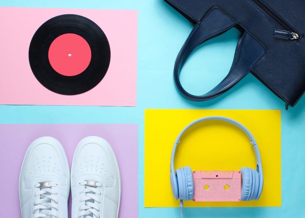 A vinyl record, pair of shoes, and headphones