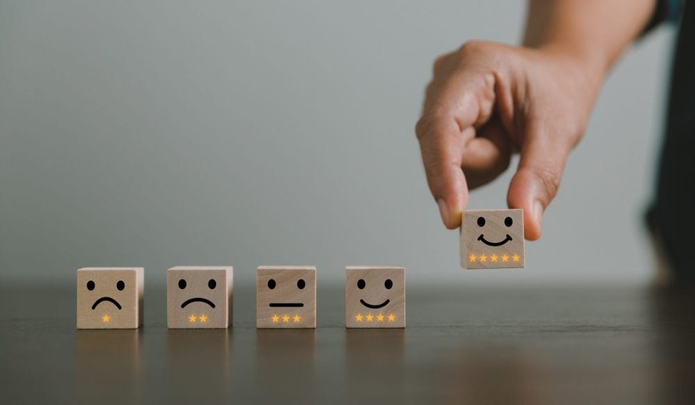 Multiple blocks with various emotional faces drawn on them