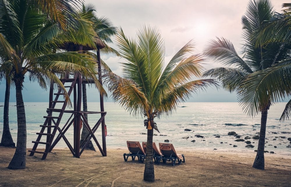 Color toned picture of an empty tropical beach, travel concept,
