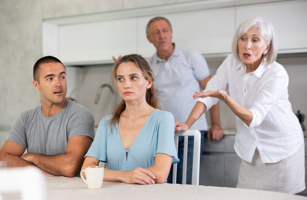 older couple arguing with younger couple