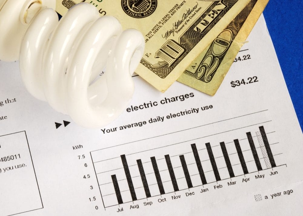 a pile of bills on an electric bill