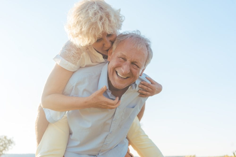 A happy senior pair of retirees who aren't paying too much because of tax breaks