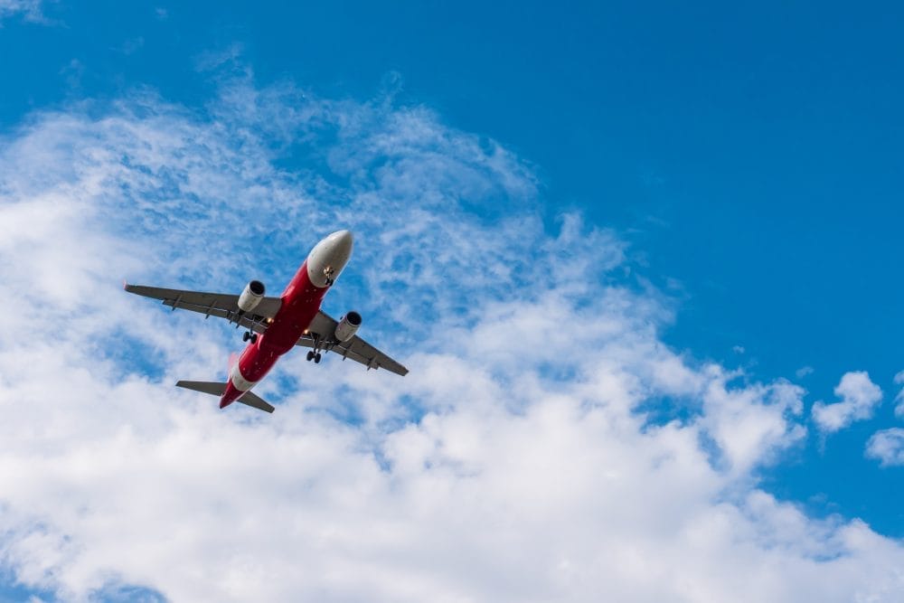 An airplane belonging to one of the top airlines flying in the sky