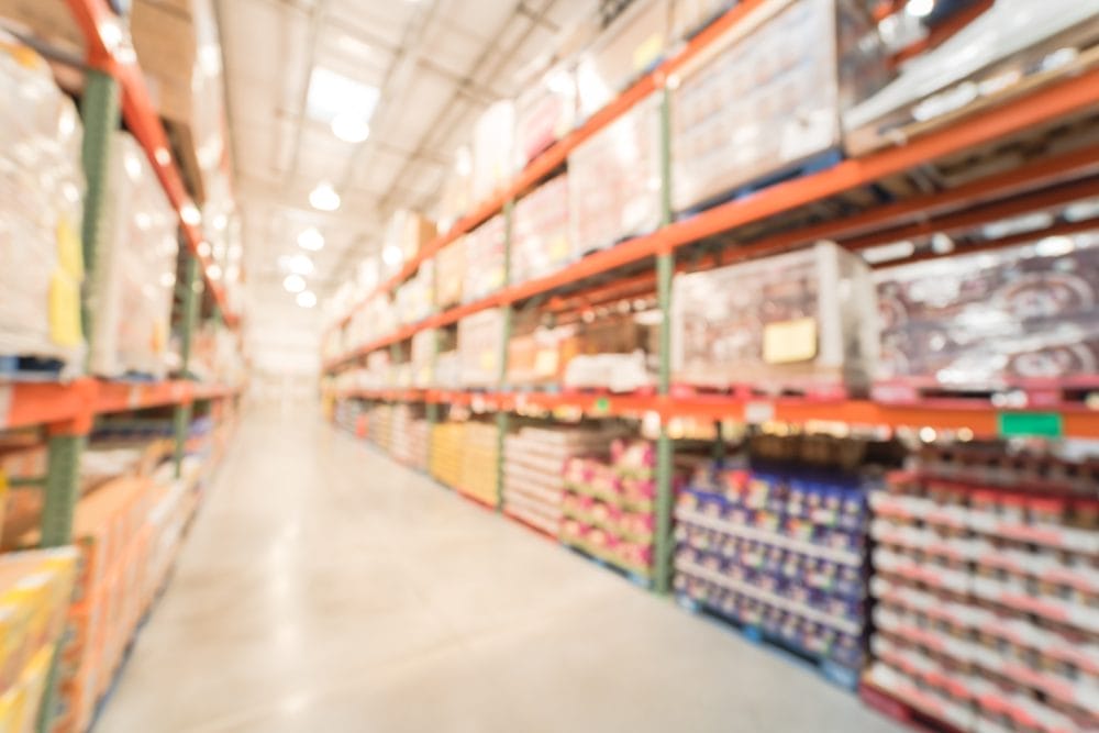 Blurry Costco store with full shelves of products