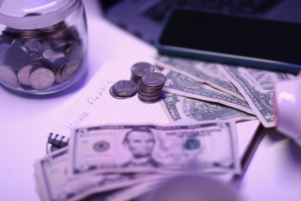 A table with cash and coins on it