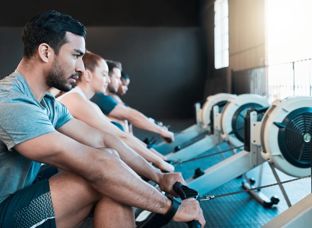 Meeting someone new at the gym among a bunch of strangers on rowing machines