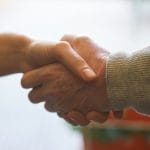 Two people shaking hands
