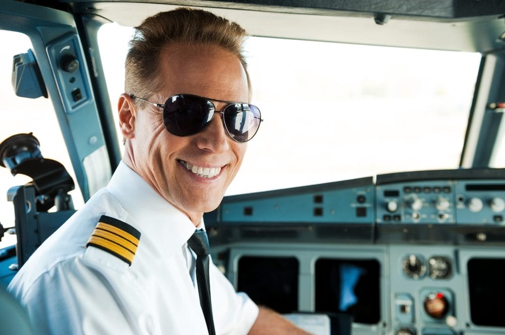 Pilot looking happy in a cockpit