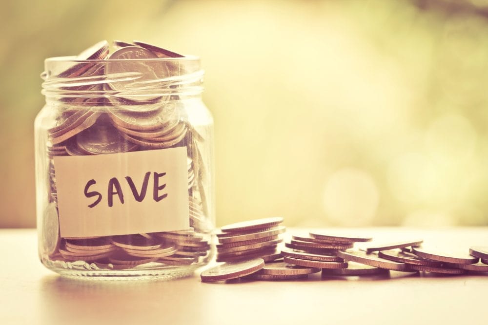 Coins in glass jar for saving