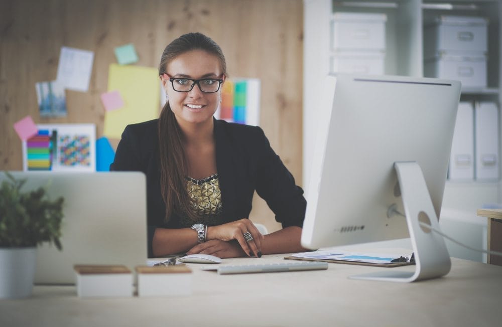 A woman working at her office computer