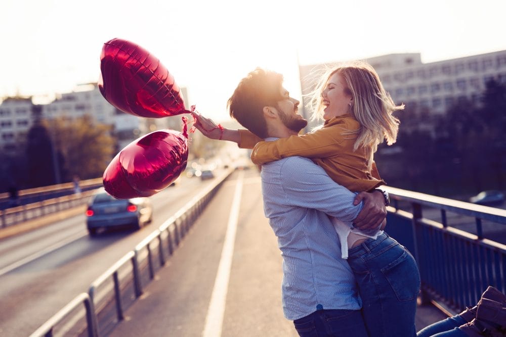 Couple in love kissing laughing and having fun