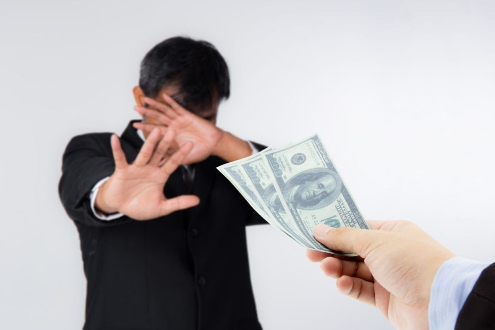 A man going through an act of self-sabotage and rejecting money he shoud have