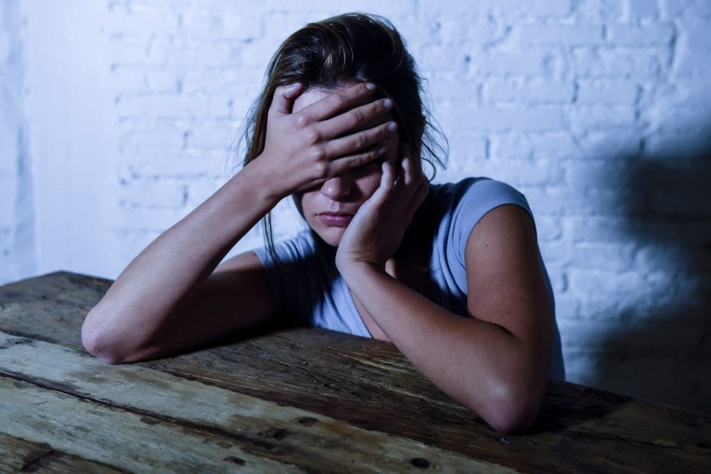 young beautiful sad and depressed woman looking wasted and frustrated suffering pain and depression 