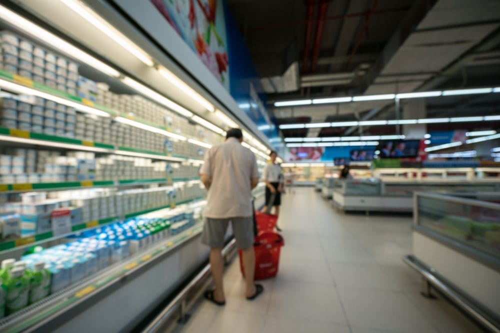Supermarket blurred background with colorful shelves