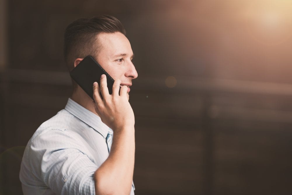 A man talking on the phone instead of texting, which may seem polite but isn't
