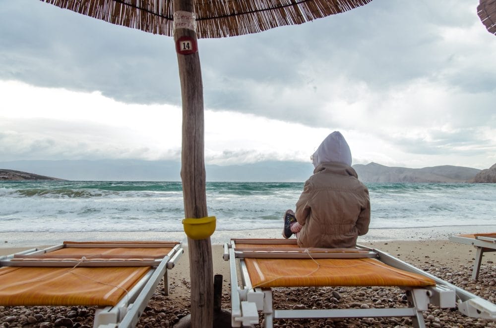 Someone stuck in bad weather on a family vacation