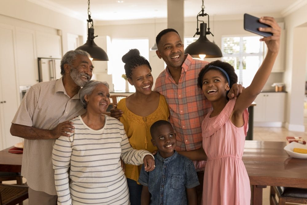 A family connecting and taking a picture. Being with family is an event that can instantly change your life for the better.