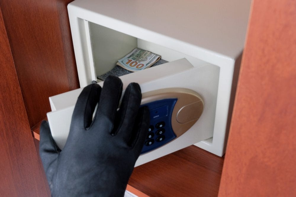 Someone storing their valuables in a safe 
