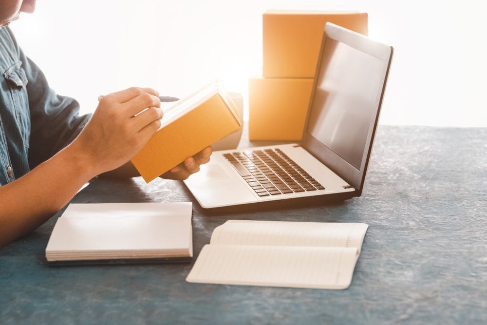 Someone selling items online, which is a hidden income stream that you can start without quitting your job