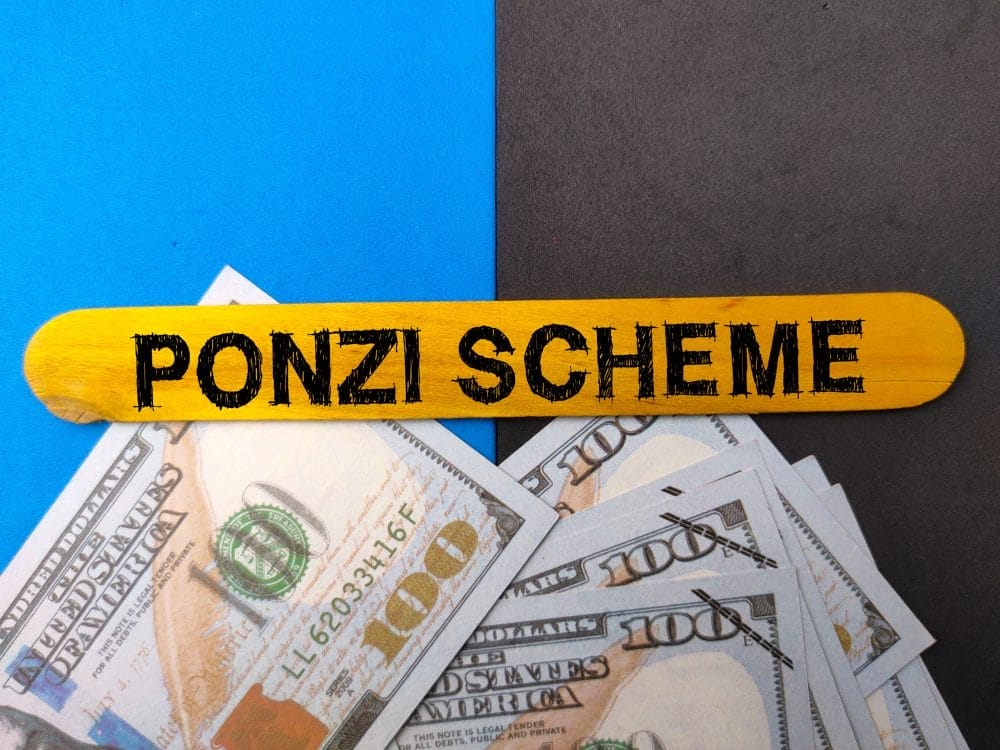 Ponzi scheme: an example of rich people getting caught scamming everyone.