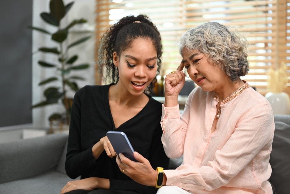 A grandmother with her daughter doing one of the things that grandparents do that offend modern parents