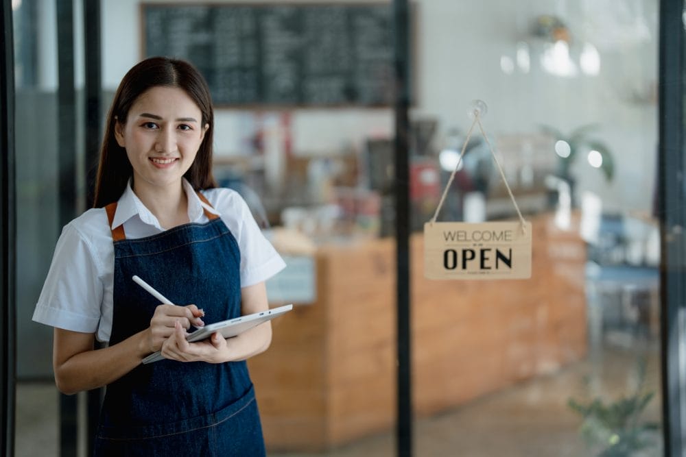 A young woman working at her starter job as a barista