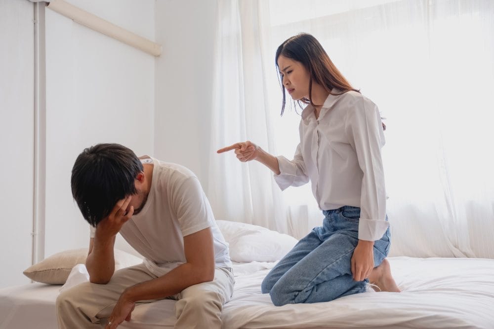 A woman arguing with her husband who is cheating with a mistress