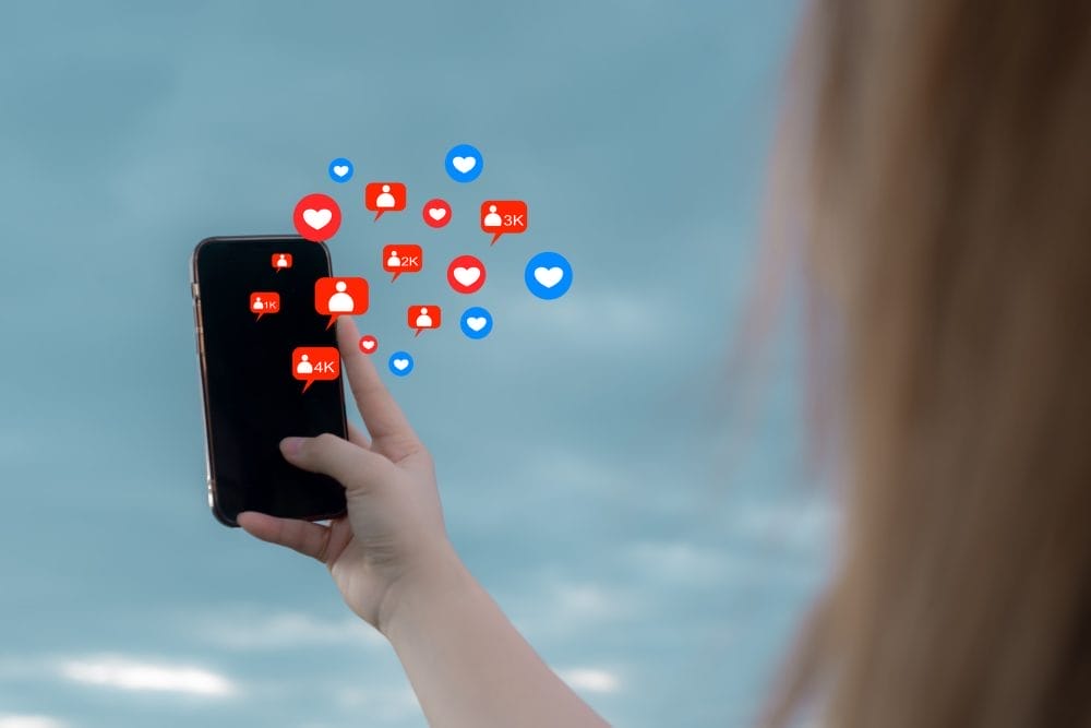 A woman spending too much time using social media on her phone