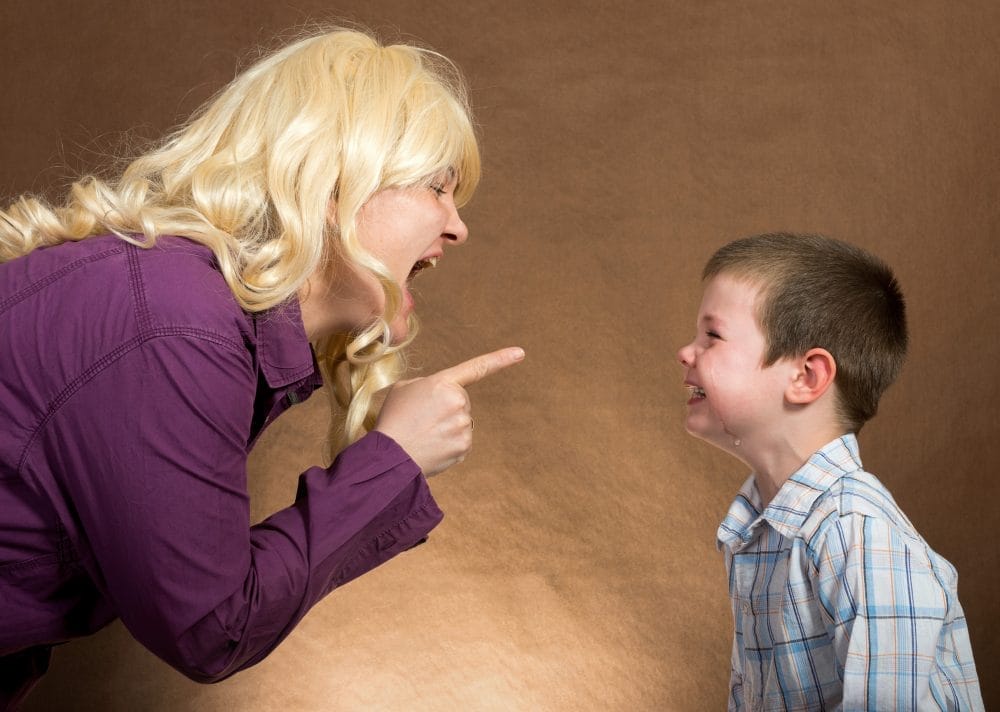 A mother yelling at her son in anger