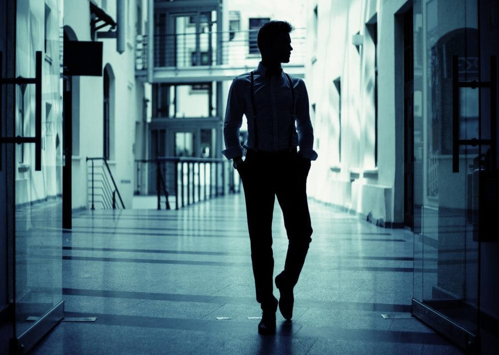 A man walking away, as if he is going to ghost his partner