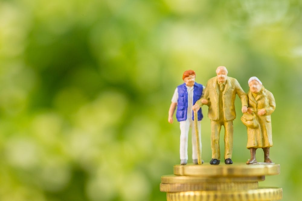 Model family on a stack of coins, symbolizing generational wealth