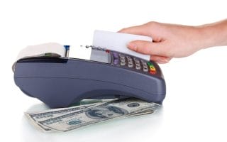 A consumer using a debit card and facing overdraft fees