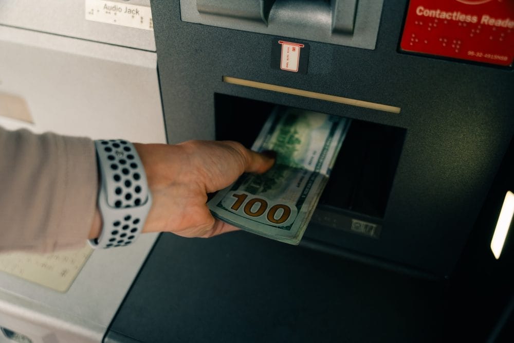 Pulling money out of an ATM after a banking scandal and rebranding