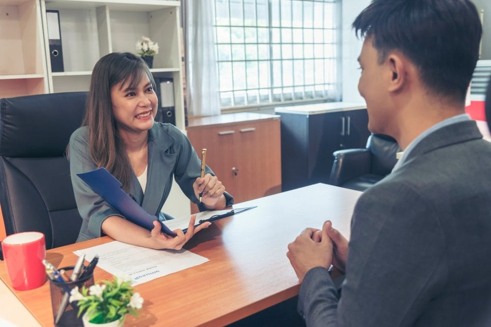 A man sitting down for a job interview