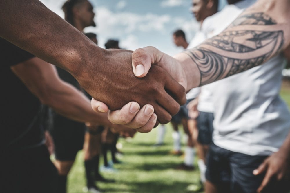 Men shaking hands to be the peacemaker