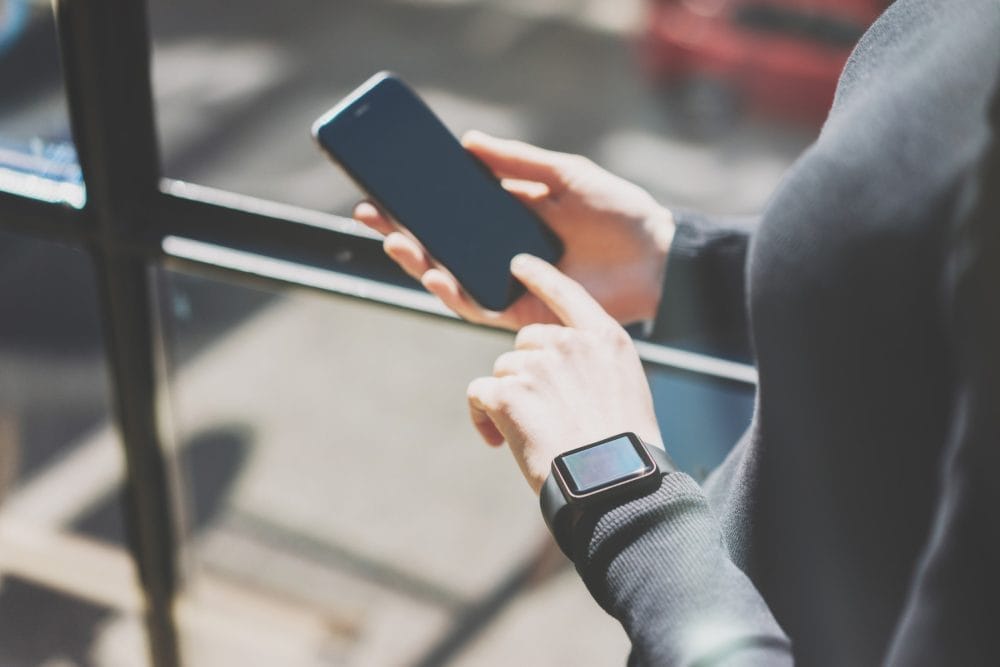 A watch and phone, two smart devices that may be listening during legal consults.