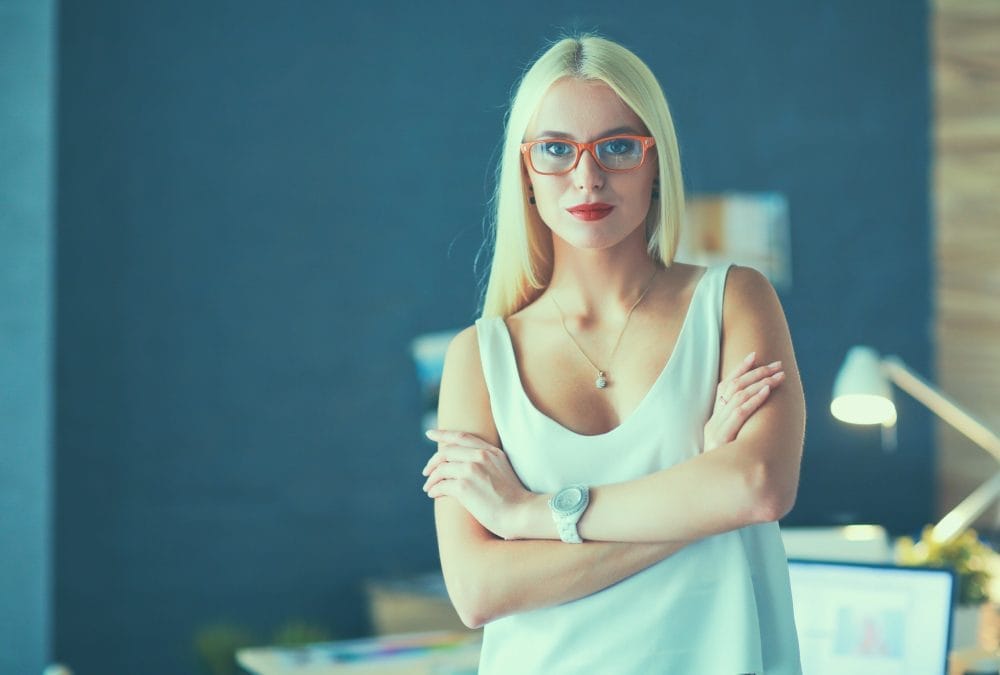 A woman with crossed arms, looking defensive
