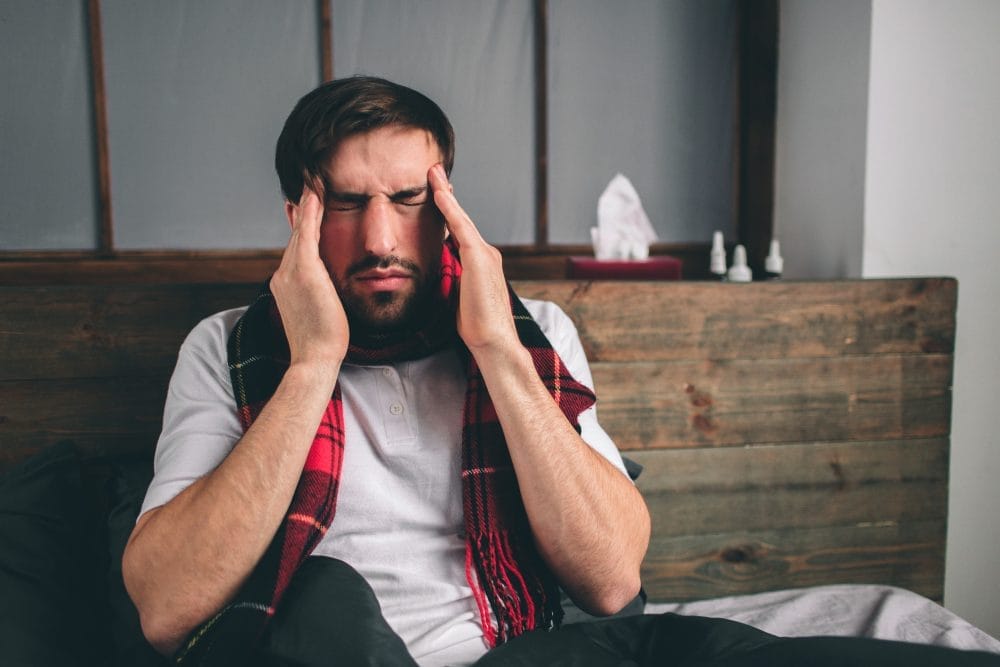 A man suffering from side effects from taking medicine