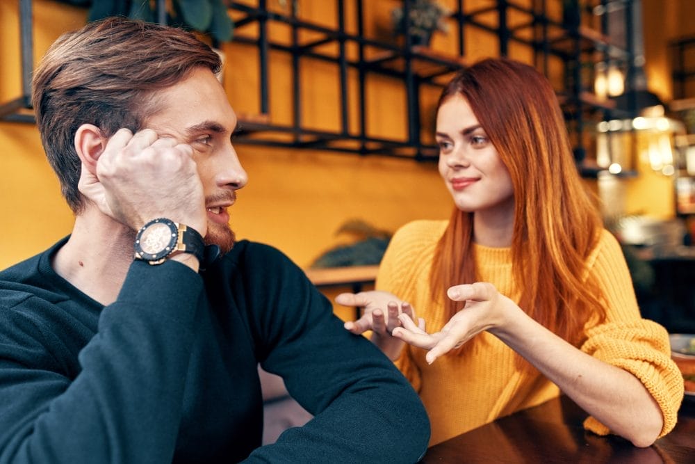 There are some body language signs that say she's studying your wallet, not your face.